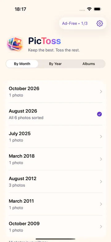 PicToss home screen listing months with their number of photos and a By Month, By Year, Albums selector.
